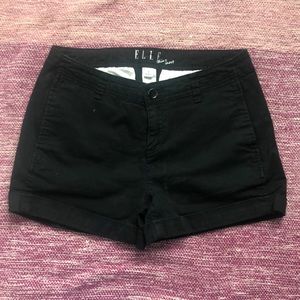 Black “khaki” style shorts.